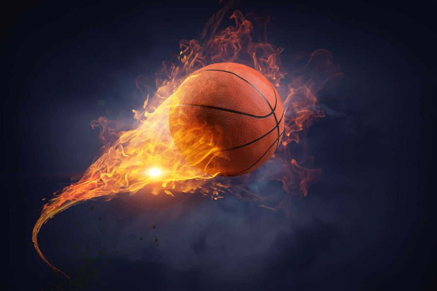 Basketball ball in fire flames on black background