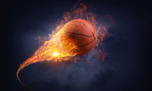 Basketball ball in fire flames on black background